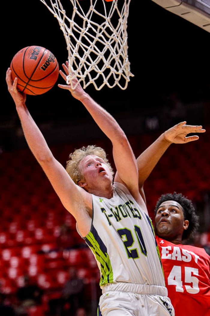 (Trent Nelson | The Salt Lake Tribune)  East vs. Timpanogos, 5A State high school basketball tournament at the Huntsman Center in Salt Lake City, Wednesday Feb. 28, 2018. Timpanogos's Logan Wilkey (20) defended by East's Mikey Frazier (45).