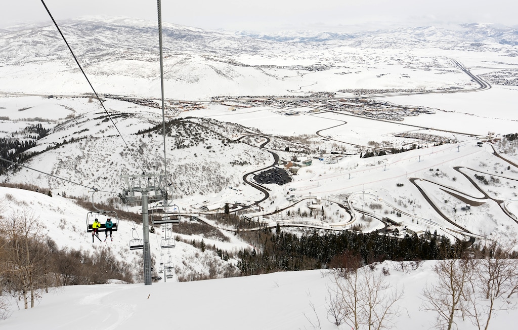 (Leah Hogsten | The Salt Lake Tribune) Clear skies allow the distant mountains and I-80 to be seen from the Spencer F. Eccles Olympic Mountain Center ski runs located on the west side of Olympic Park on Wednesday, March 1, 2023. Organizers of Utah's Olympic bid say improving the state's air and environment are a high priority.