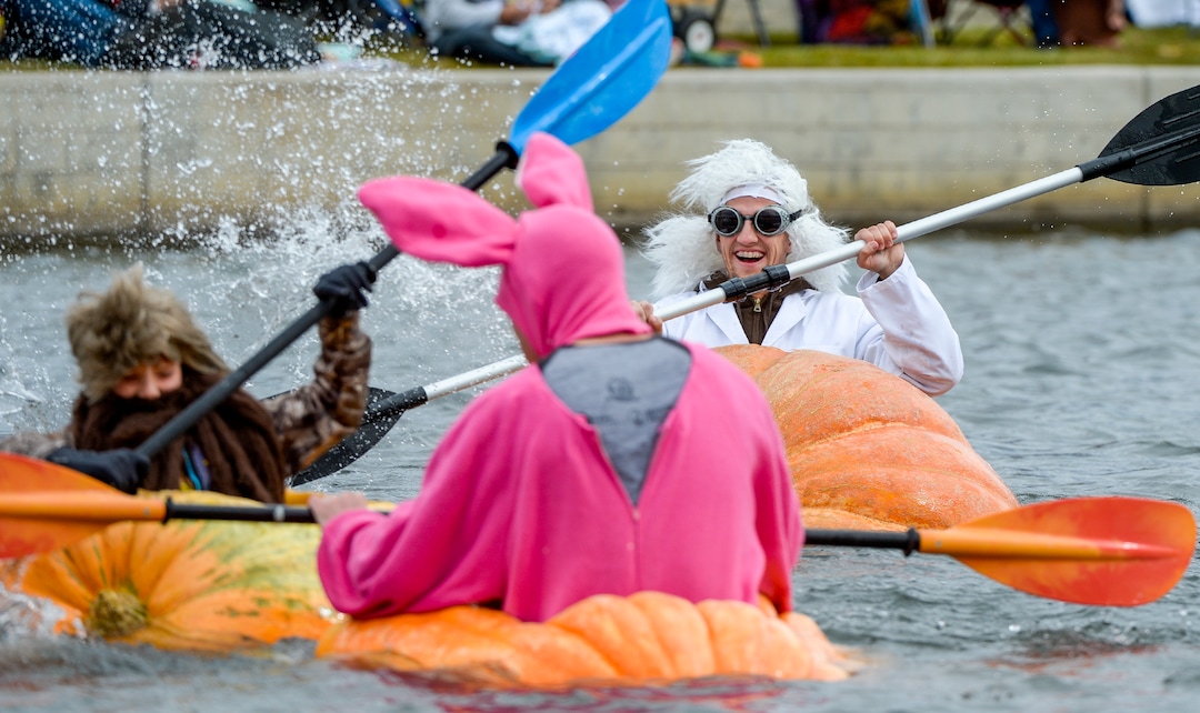 (Leah Hogsten  |  The Salt Lake Tribune) Mad Scientist Indy Heaton splashes other competitors during the annual Giant Pumpkin Regatta, October 19, 2019 on Oquirrh Lake in Daybreak, South Jordan.
