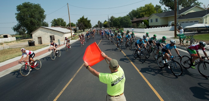 (Rick Egan  |  The Salt Lake Tribune)  Cyclists spot sides of a round-a-bout in Layton, in the Tour of Utah Stage 5, Friday, August 4, 2017.


