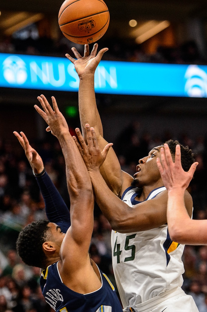 (Trent Nelson | The Salt Lake Tribune)  Utah Jazz guard Donovan Mitchell (45) shoots as the Utah Jazz host the Denver Nuggets, NBA basketball in Salt Lake City, Wednesday October 18, 2017.