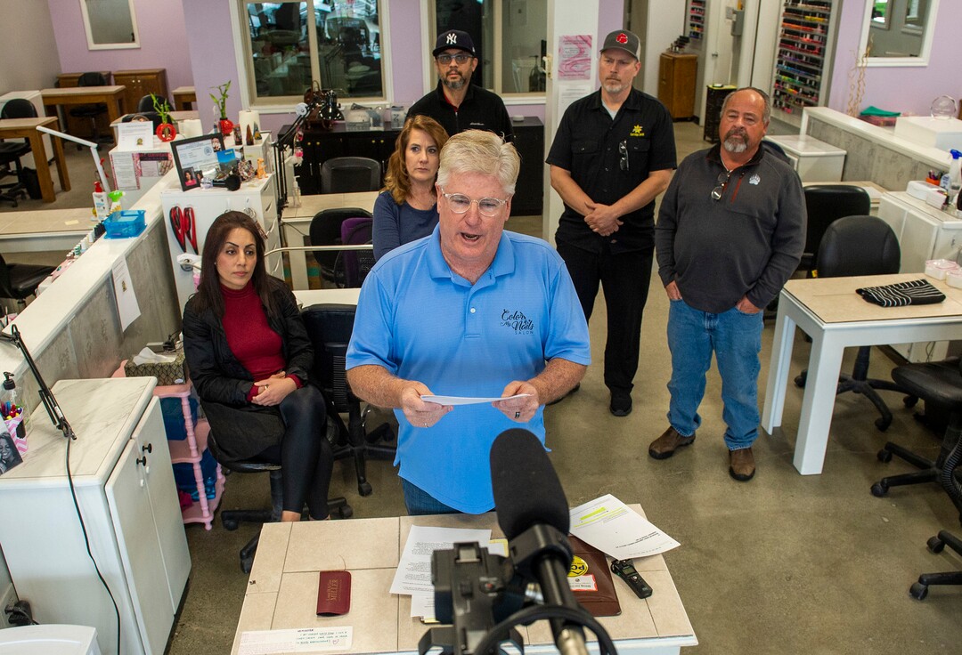 (Rick Egan  |  The Salt Lake Tribune)    Surrounded by other small business owners, Doug Jardine owner of Color My Nails Salon, talks about the impact COVID-19 is having on small businesses, during. news conference at his salon in Midvale, Wednesday, March 25, 2020.