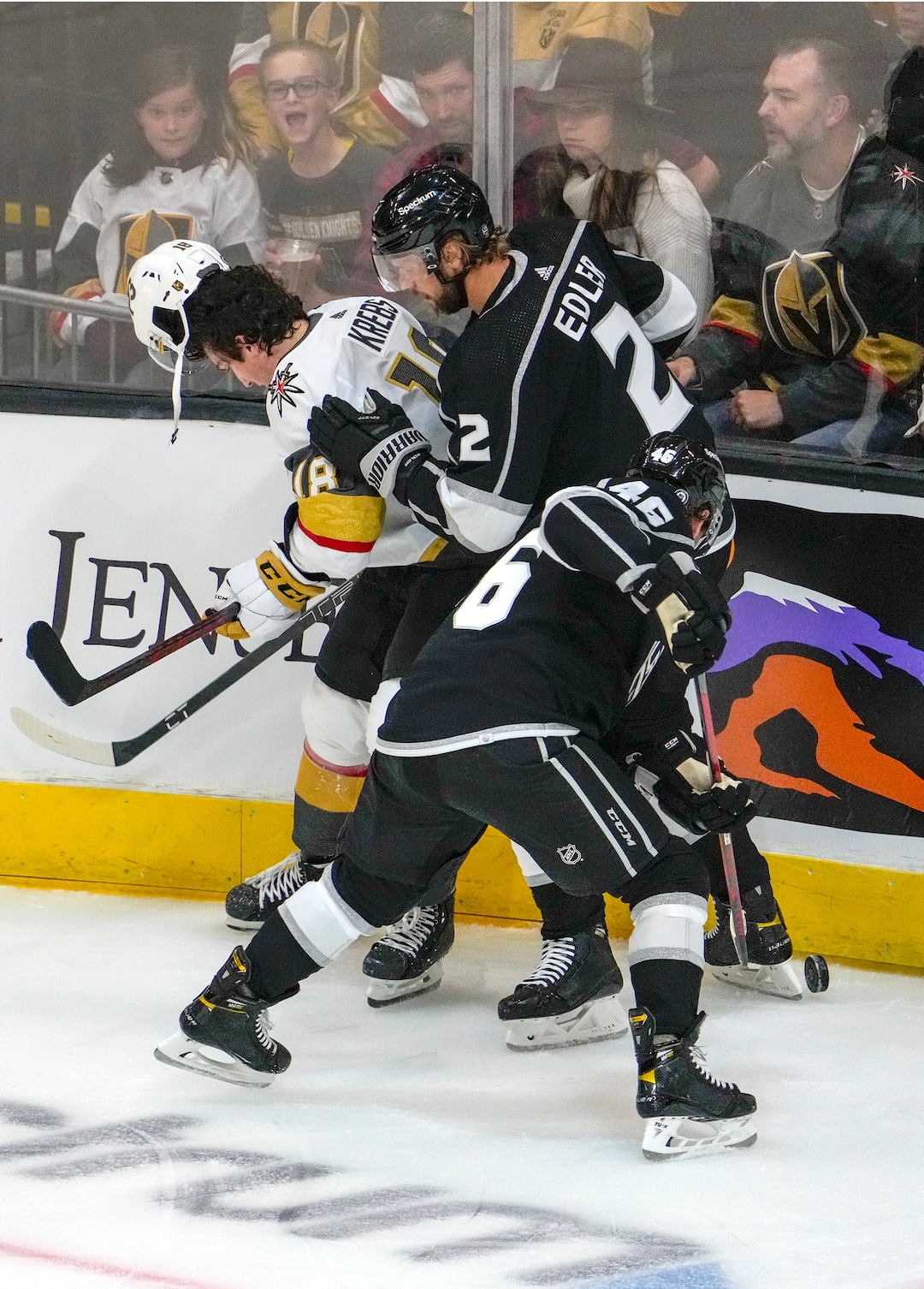 (Leah Hogsten | The Salt Lake Tribune) Vegas Golden Knights left wing Peyton Krebs (18) loses his helmet battling Los Angeles Kings defenseman Alexander Edler (2) and Los Angeles Kings center Blake Lizotte (46) as the Los Angeles Kings and Vegas Knights meet in a preseason game at Vivint Arena on Sept. 30, 2021.