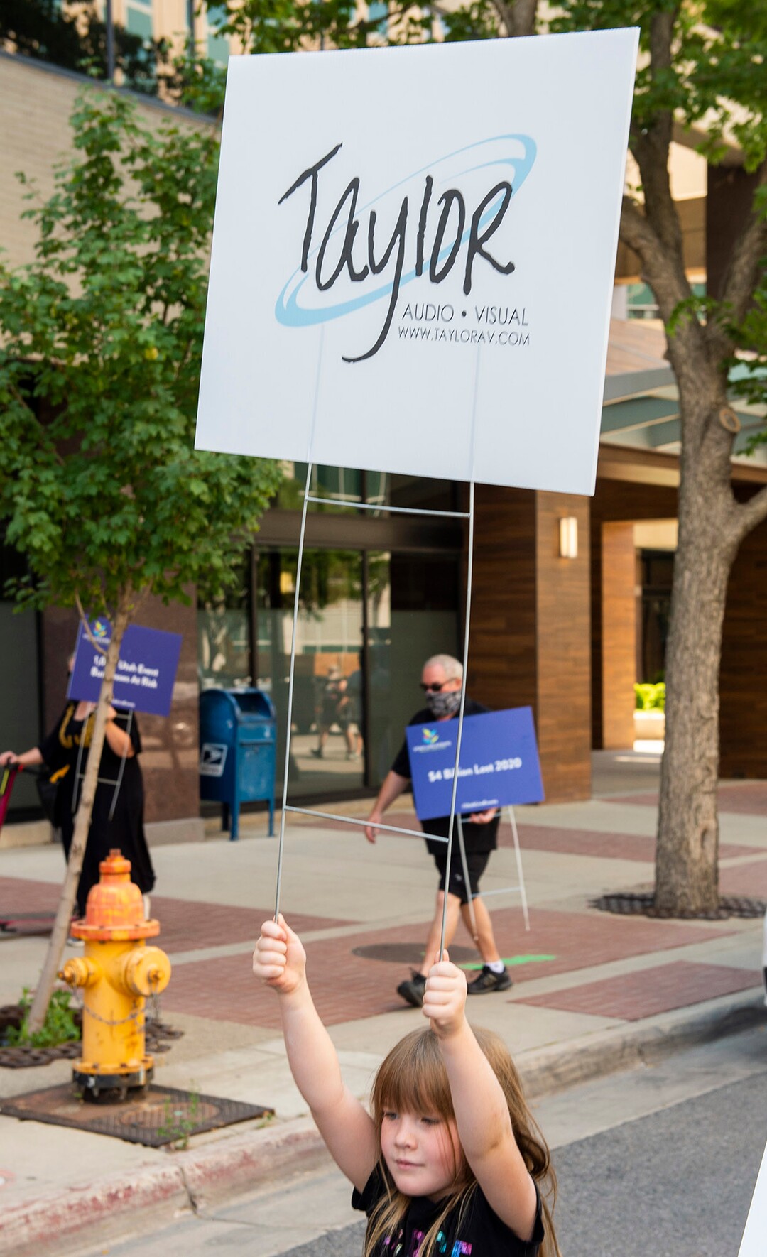(Rick Egan  |  The Salt Lake Tribune)     Jessica Young joins more than 100 members of Utah Live Events Industry Association as they march to the State Capitol in a silent march to call attention to the state of their industry, on Tuesday, July 21, 2020.