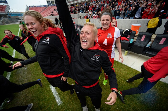(Scott Sommerdorf   |  The Salt Lake Tribune)   American Fork Derek Dunn celebrates with his team as the Cavemen beat Syracuse 3-1 to win the 6A championship game played at Rio Tinto, Friday, October 20, 2017. 