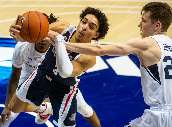 (Rick Egan | The Salt Lake Tribune)  Brigham Young Cougars guard Brandon Averette (4),and Brigham Young Cougars guard Spencer Johnson (20) double-team Gonzaga Bulldogs guard Andrew Nembhard (3), in West Coast Conference Basketball action between the Brigham Young Cougars and the Gonzaga Bulldogs at the Marriott Center in Provo, on Monday, Feb. 8, 2021.