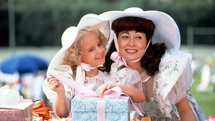Faye Dunaway (right) plays movie legend Joan Crawford, with her adopted daughter Christina (Mara Hobel), in the 1981 drama "Mommie Dearest." (Courtesy Paramount Pictures)