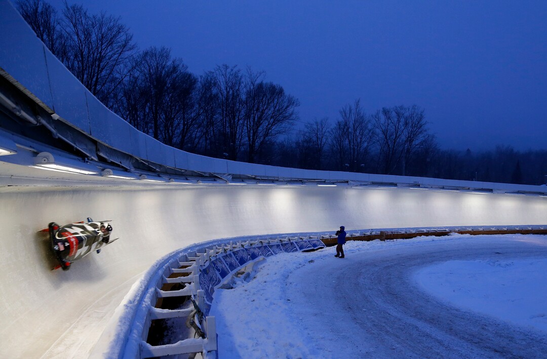 Steven Holcomb pilots with brakeman Jesse Beckom during a training run for the two-man bobsled World Cup competition on Thursday, Dec. 12, 2013, in Lake Placid, N.Y. Competition starts on Friday. (AP Photo/Mike Groll)