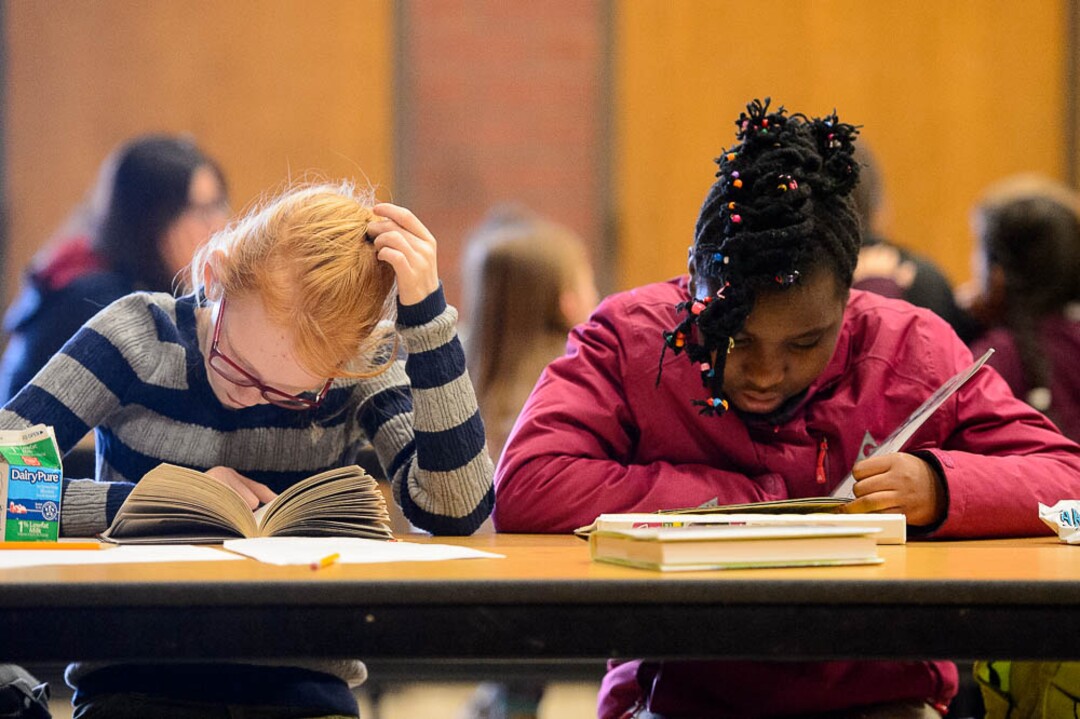 (Trent Nelson | The Salt Lake Tribune) Bella Maycock and Abolina Shakiye read in an after school program at Salt Lake City's Bennion Elementary, which might be closing due to low enrollment. The school district is holding a meeting  Tuesday Feb. 19, 2019 to discuss the issue and hear from parents.
