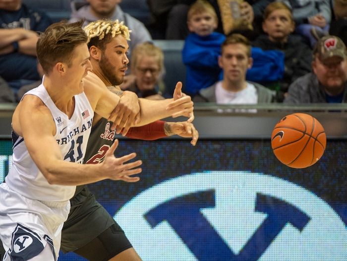 (Rick Egan  |  The Salt Lake Tribune)       Brigham Young Cougars forward Luke Worthington (41) goes for the ball along with Santa Clara Broncos center Ezekiel Richards (23), in basketball action between Brigham Young Cougars and Santa Clara Broncos at the Marriott Center in Provo, Saturday, Jan. 12, 2019.


