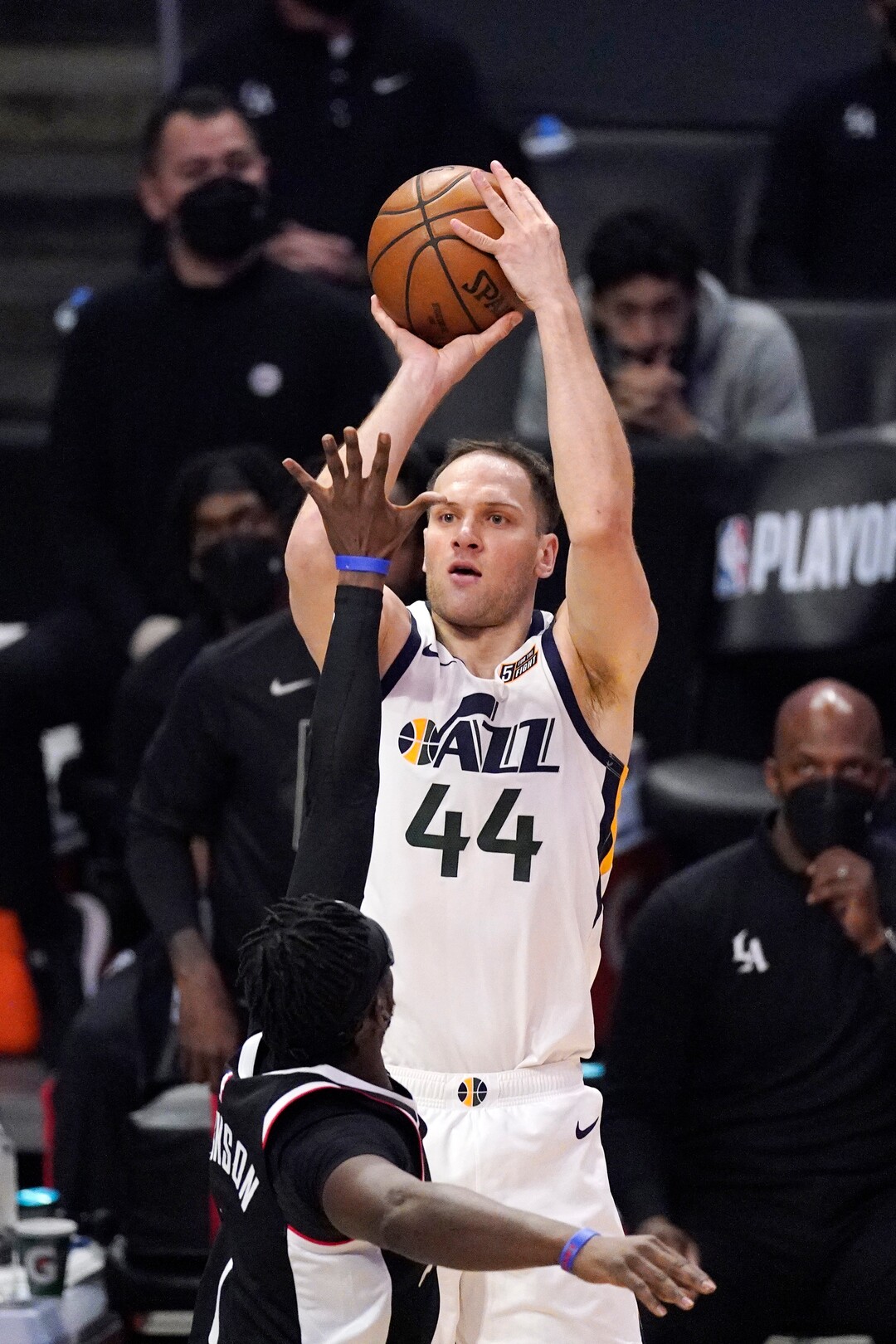 Utah Jazz forward Bojan Bogdanovic, top, shoots as Los Angeles Clippers guard Reggie Jackson defends during the second half of Game 3 of a second-round NBA basketball playoff series Saturday, June 12, 2021, in Los Angeles. (AP Photo/Mark J. Terrill)
