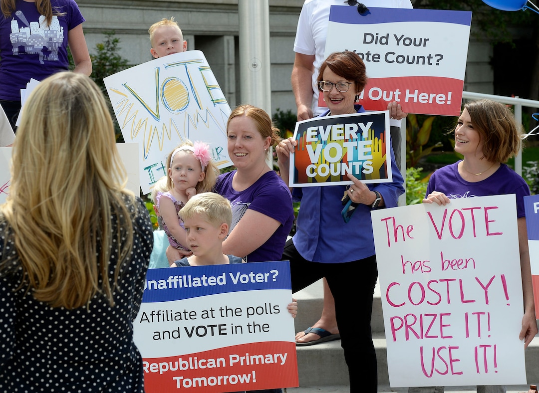 (Al Hartmann  |  The Salt Lake Tribune) Mormon Women for Ethical Government, Salt Lake Indivisible and Action Utah members  rally against the confusing process of special election to fill Chaffetz' 3rd District seat outside the historical courthouse in Provo Monday Aug 14. 