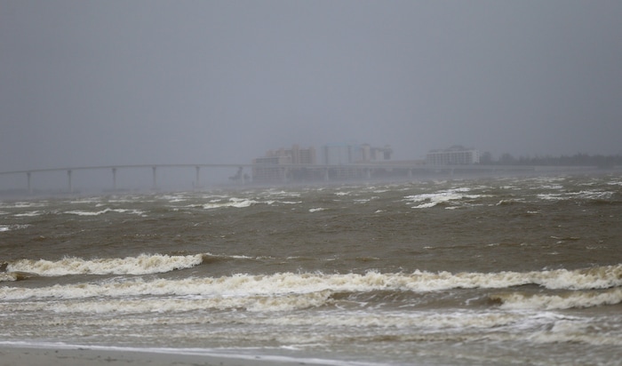 Fort Myers is seen as surf and winds begin to kick up in advance of Hurricane Irma, in Sanibel Island, Fla., Sunday, Sept. 10, 2017. Irma as turned towards the West coast of Florida and may give the Tampa area its first direct hit from a major hurricane in nearly a century. (AP Photo/Gerald Herbert)