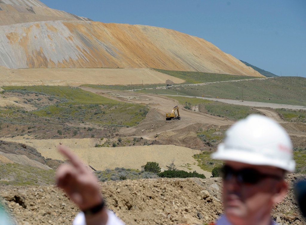 (Al Hartmann |  Tribune File Photo)  Rio Tinto spent almost $10 million last year reclaiming the east waste rock projected, pointed out in 2015 by company official Michael Piercey. and a similar waste pile south of there.