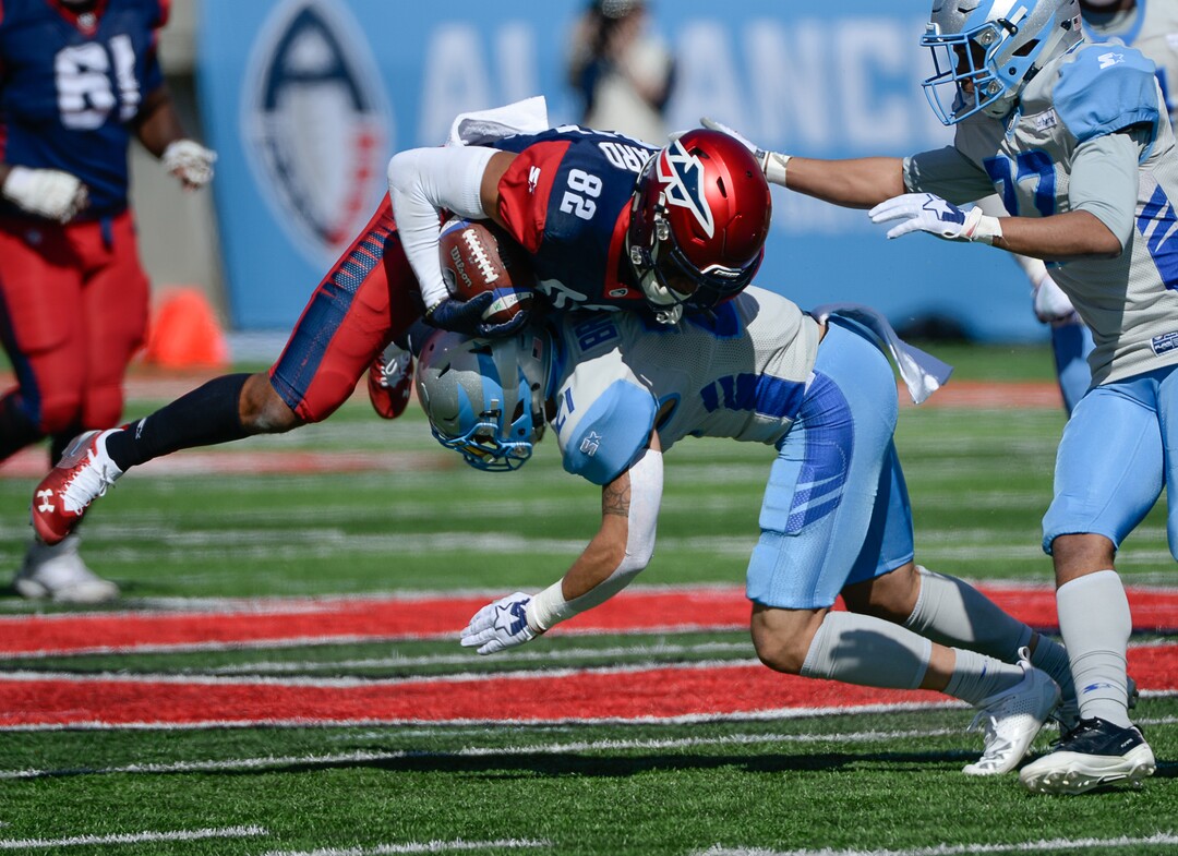 (Francisco Kjolseth  |  The Salt Lake Tribune)  Gerrard Sheppard #82 of the Memphis Express gets up ended by Cody Brown #21 of the Salt Lake Stallions as the Stallions host the Memphis Express of the Alliance of American Football in Salt Lake City on Saturday March 16, 2019.