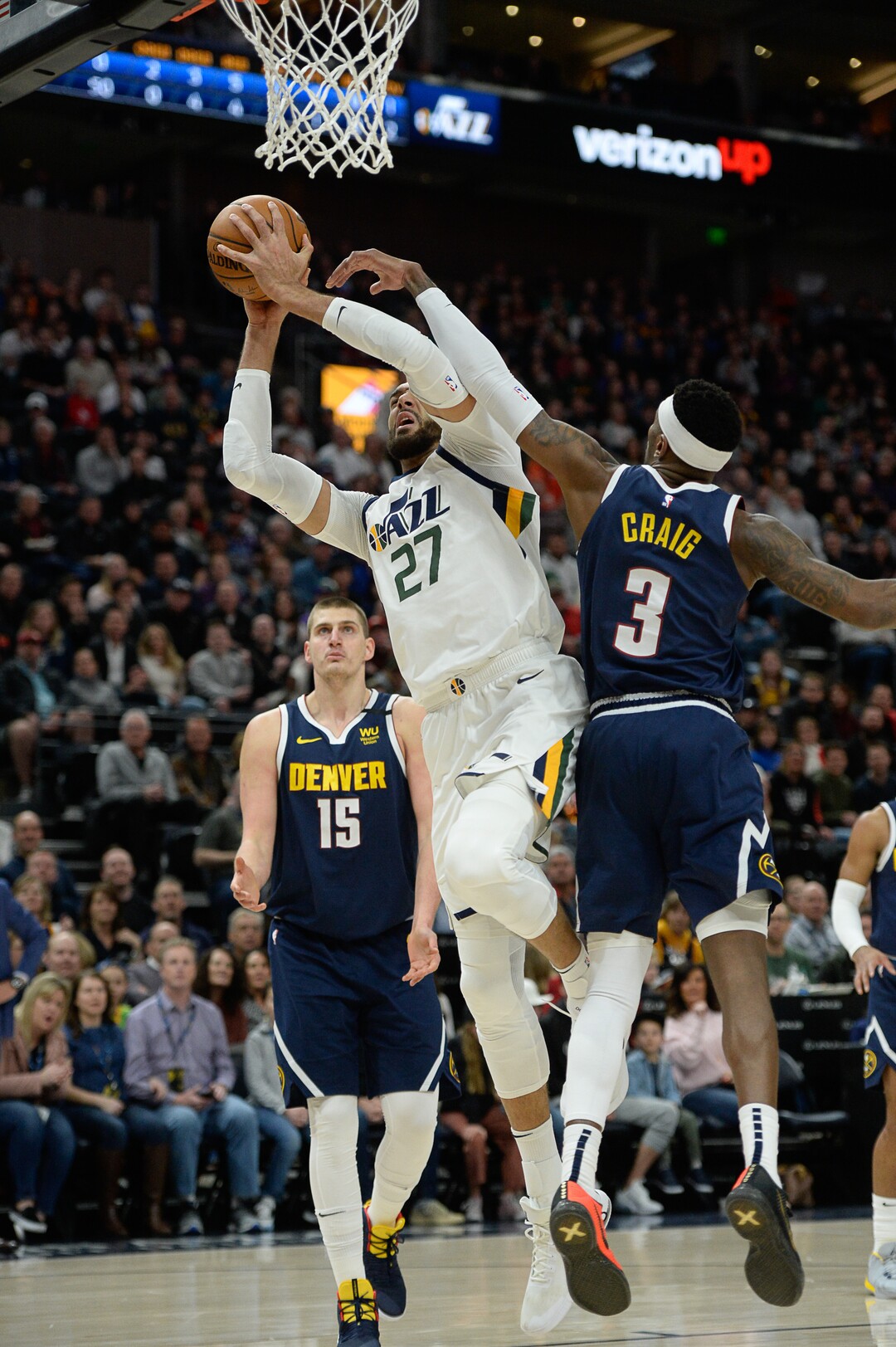 (Francisco Kjolseth  |  The Salt Lake Tribune) Utah Jazz center Rudy Gobert (27) pushes past Denver Nuggets forward Torrey Craig (3) as the Utah Jazz host the Denver Nuggets in their NBA basketball game at Vivint Smart Home Arena in Salt Lake City on Wednesday, Feb. 5, 2020.
