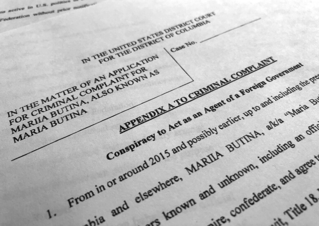 (Jon Elswick | The Associated Press) Court papers unsealed Monday, July 16, 2018, photographed in Washington, shows part of the criminal complaint against Maria Butina. She was arrested July 15, on a charge of conspiracy to act as an unregistered agent of the Russian government.