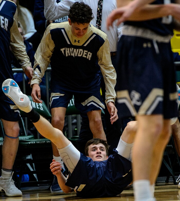 (Steve Griffin | The Salt Lake Tribune) Westlake's Jared McGregor crashes to the floor after being fouled on a three-point attempt during the 6A basketball playoff game against Riverton at the Utah Valley UniversityÕs UCCU Center in Provo Tuesday Feb. 27, 2018.