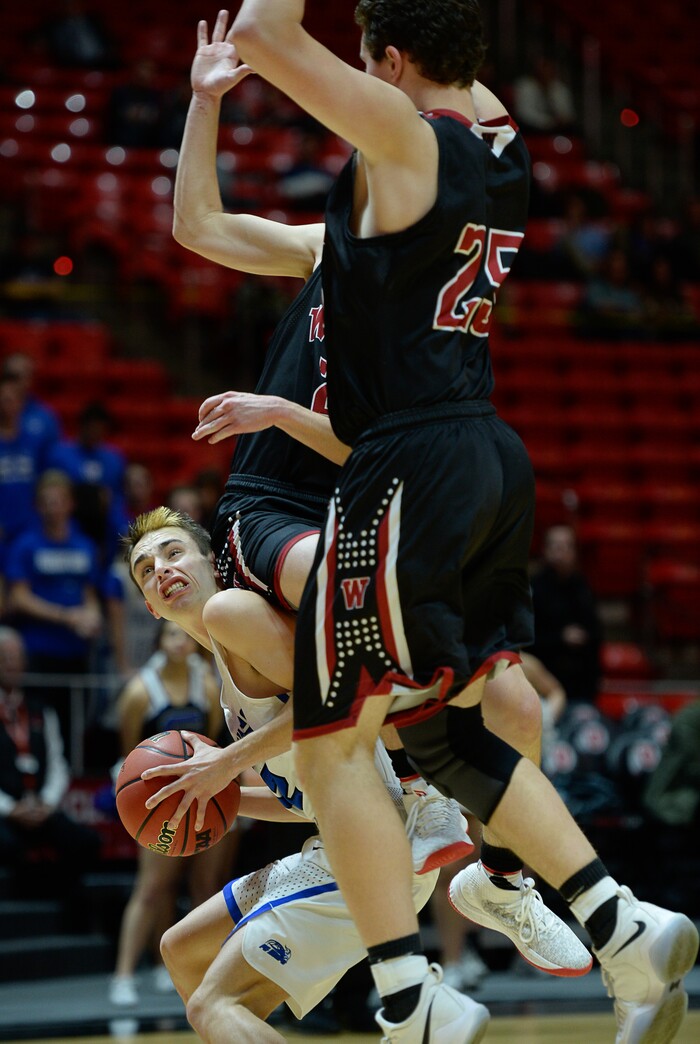 (Francisco Kjolseth  |  The Salt Lake Tribune)  Weber vs Pleasant Grove, 6A State high school basketball tournament at the Huntsman Center in Salt Lake City, Thursday March 1, 2018. Pleasant Grove's Tyler Fairbanks (12) ends up on the bottom end of the Weber defense. 