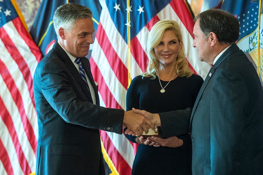 (Chris Detrick  |  The Salt Lake Tribune)  Gov. Gary R. Herbert swears in Jon M. Huntsman, Jr. as U.S. Ambassador to Russia during an Ambassadorial Swearing in Ceremony at the Utah Capitol Saturday, October 7, 2017. Mary Kaye Huntsman is in the middle.