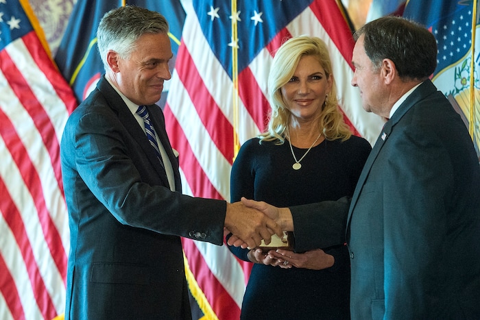 (Chris Detrick  |  The Salt Lake Tribune)  Gov. Gary R. Herbert swears in Jon M. Huntsman, Jr. as U.S. Ambassador to Russia during an Ambassadorial Swearing in Ceremony at the Utah Capitol Saturday, October 7, 2017. Mary Kaye Huntsman is in the middle.