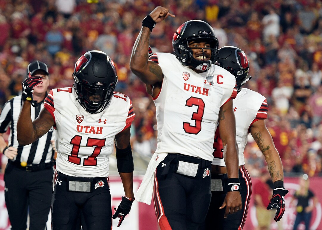 Utah wide receiver Demari Simpkins, left, celebrates after catching a touchdown pass from quarterback Troy Williams during the first half of an NCAA college football game against Southern California in Los Angeles, Saturday, Oct. 14, 2017. (AP Photo/Kelvin Kuo)