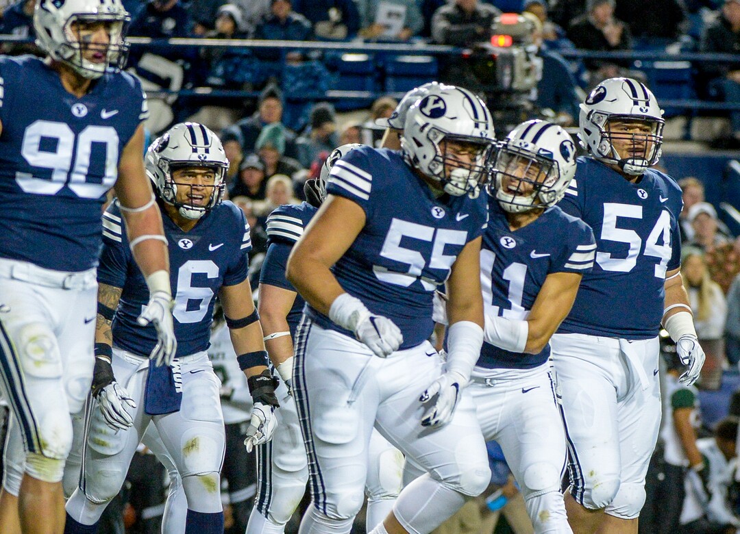 Leah Hogsten  |  The Salt Lake Tribune Brigham Young Cougars defensive lineman Lorenzo Fauatea (55) and Brigham Young Cougars defensive back Austin Lee (11) celebrate shutting down the Warrior offense as Brigham Young University hosts Hawaii at Lavell Edwards Stadium in Provo, Saturday Oct. 13, 2018. 