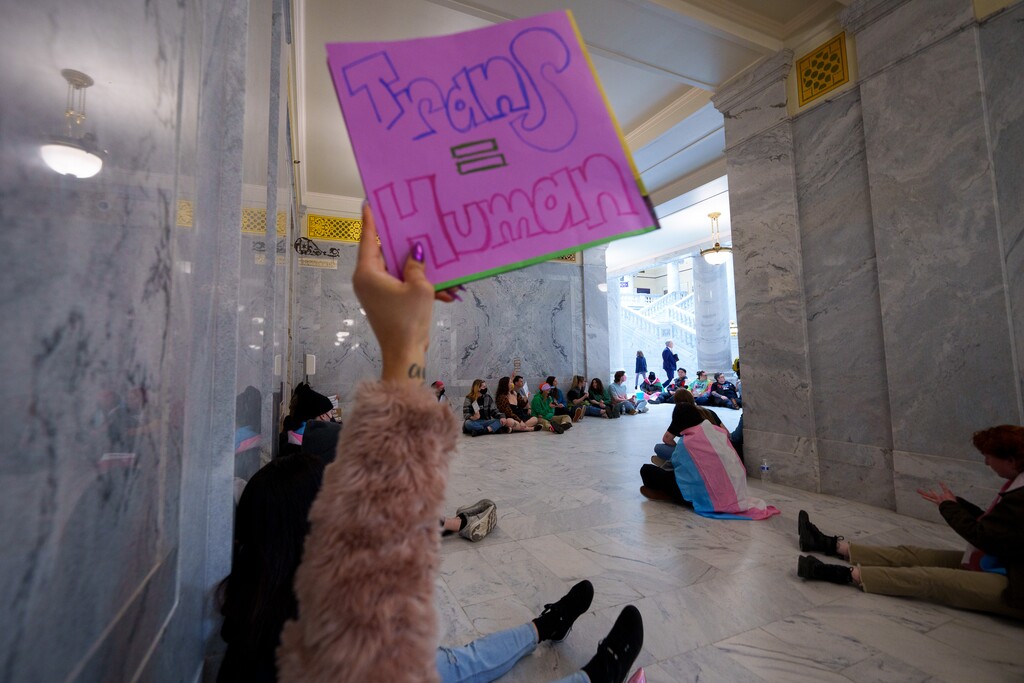 (Trent Nelson  |  The Salt Lake Tribune) Activists in support of transgender rights hold a sit-in in front of a bathroom at the Utah Capitol in Salt Lake City on Thursday, Feb. 22, 2024.