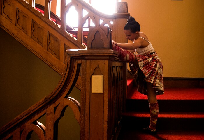 (Leah Hogsten  |  The Salt Lake Tribune) Erica Stewart stretches in the stairwell prior to performing in Saturday's Highland Dance Competition, October 28, 2017 at the First Presbyterian Church during its annual two-day Scottish Festival celebrating the Scottish heritage of the church. 