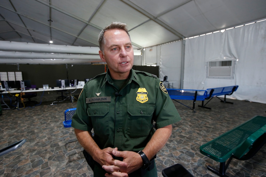 (Ross D. Franklin | AP Photo) U.S. Border Patrol Chief Patrol Agent Yuma Sector, Anthony Porvaznik talks about their new 500-person tent facility during a media tour Friday, June 28, 2019, in Yuma, Ariz. The facility will be used to process detained immigrant children and families who cross the U.S. border. The Border Patrol says it will start placing families there on Friday night.