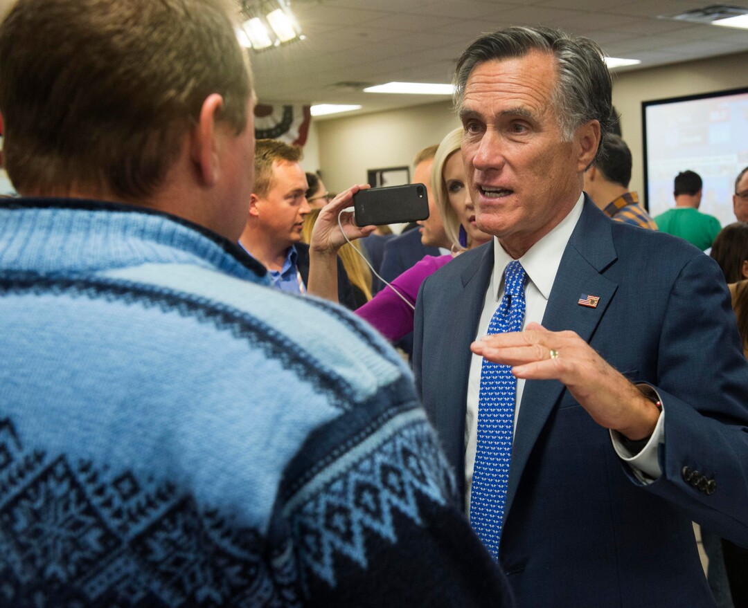 (Rick Egan  |  The Salt Lake Tribune)   Mitt Romney visit with Danny Goode and his son Russell Goode, 7, at the Romney Headquarters, in Orem, as they wait for the polls to close, on election night, Tuesday, Nov. 6, 2018.