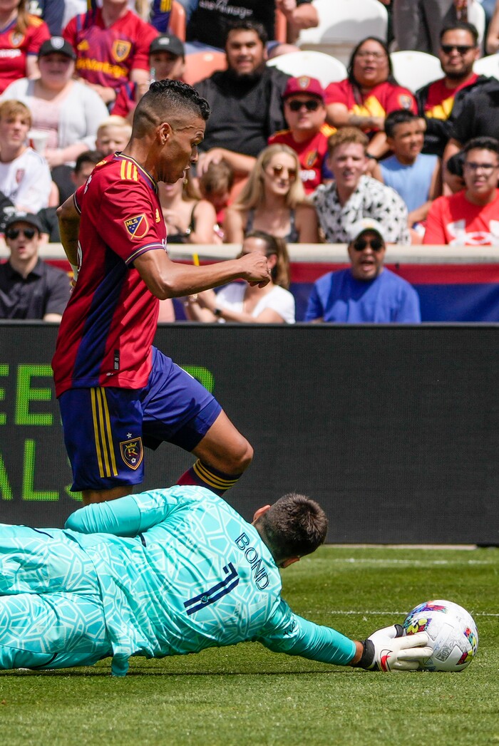 (Leah Hogsten | The Salt Lake Tribune) Real Salt Lake midfielder Maikel Chang (16) dribbles past Los Angeles Galaxy goalkeeper Jonathan Bond (1) on a drive as Real Salt Lake hosts LA Galaxy at Rio Tinto Stadium, Saturday, April 30, 2022.