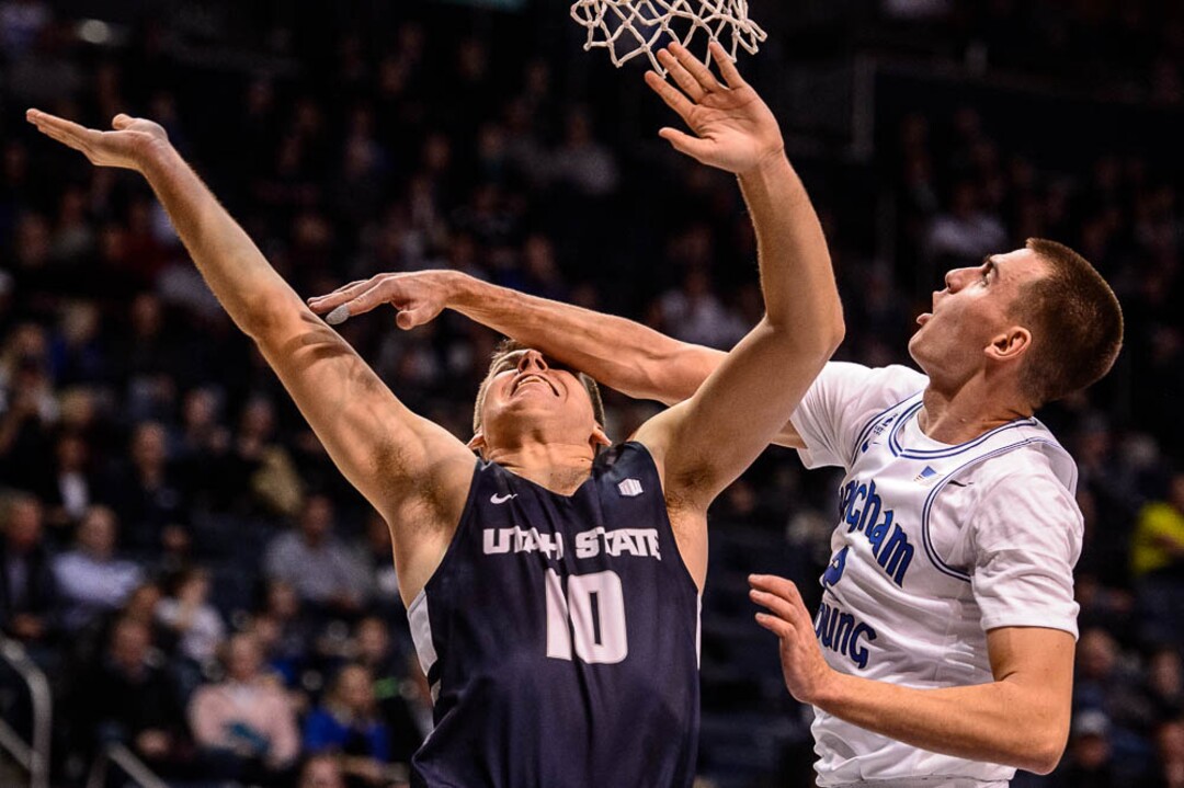 (Trent Nelson | The Salt Lake Tribune)  Brigham Young Cougars guard Zac Seljaas (2) gets a hand on Utah State Aggies forward Quinn Taylor (10) as BYU hosts Utah State, NCAA basketball in Provo on Wednesday Dec. 5, 2018.