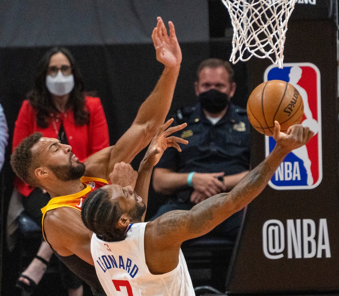 (Rick Egan | The Salt Lake Tribune) LA Clippers forward Kawhi Leonard (2) shoots as Utah Jazz center Rudy Gobert (27) defends, in NBA action between the Utah Jazz and the LA Clippers, in game one in the second round of the NBA playoff series at Vivint Arena, on Tuesday, June 8, 2021.