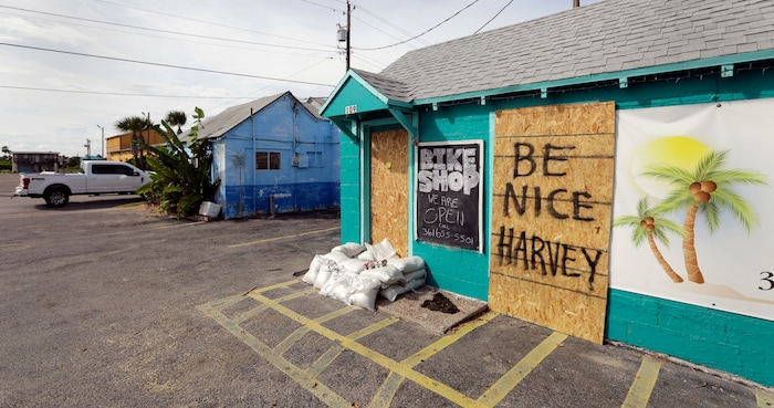 (Eric Gay | The Associated Press)  A sign reading "Be Nice Harvey" was left behind on a boarded up business, Thursday, Aug. 24, 2017, in Port Aransas, Texas. Port Aransas is under a mandatory evacuation for Hurricane Harvey. Harvey intensified into a hurricane Thursday and steered for the Texas coast.
