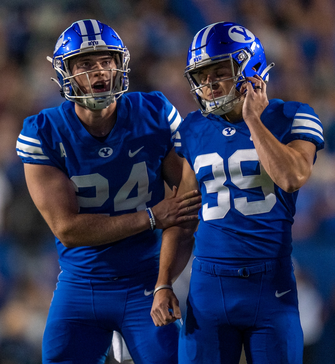 (Rick Egan | The Salt Lake Tribune)  Brigham Young Cougars punter Ryan Rehkow (24) consoles Cougars place kicker Jake Oldroyd (39) after he missed his kick, in overtime in football action between the Brigham Young Cougars and the Baylor Bears at LaVell Edwards Stadium in Provo, on Saturday, Sept. 10, 2022.