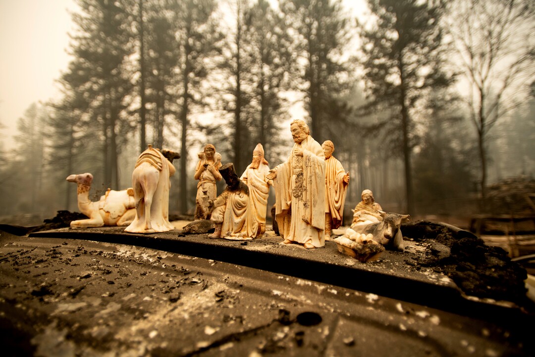 Figurines rest atop a car burned by the Camp Fire in Paradise, Calif., on Thursday, Nov. 15, 2018. The fires in Northern and Southern California started last week and prompted the evacuation of hundreds of thousands of people and the destruction of thousands of homes. Dozens of people were killed in and nearby the Northern California town of Paradise, which was leveled by the fire. (AP Photo/Noah Berger)
