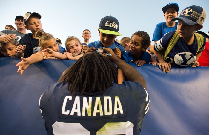 (Rick Egan  |  The Salt Lake Tribune)    Brigham Young Cougars running back Squally Canada (22) signs autographs after the Brigham Young Cougars defeated the McNeese State Cowboys 30-3, at Lavell Edwards Stadium, Saturday, Sept. 22, 2018.


