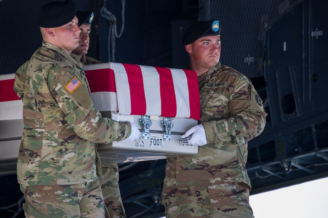 (Alex Brandon  |  AP Photo) An Army carry team moves a transfer case containing the remains of U.S. Army Sgt. 1st Class Elliott J. Robbins, at Dover Air Force Base, Del., Tuesday, July 2, 2019. According to the Department of Defense, Robbins, of Ogden, Utah, assigned to the 10th Special Forces Group died while supporting Operation Freedom's Sentinel.