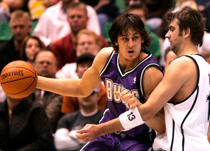 Andrew Bogut goes against Mehmet Okur in his first game in Salt Lake in the NBA.  photo by Rick Egan 11/21/2005