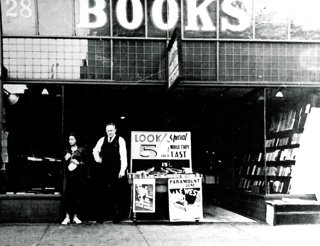 (Photo courtesy of Weller Book Works) Founder Gus Weller, right, at the entrance to Zion Bookstore at its location at 28 E. 100 South, around 1932.