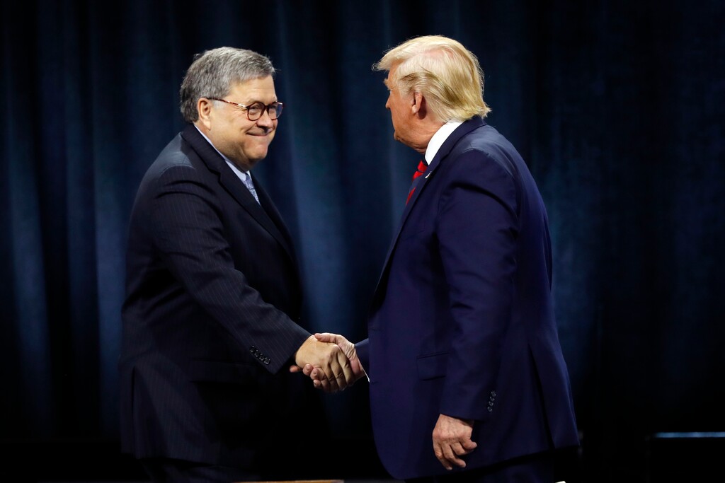 (Charles Rex Arbogast | AP file photo) In this Oct. 28, 2019 photo, President Donald Trump shakes hands with Attorney General William Barr at the International Association of Chiefs of Police Convention in Chicago. Attorney General William Barr took a public swipe Thursday at President Donald Trump, saying that the president’s tweets about Justice Department prosecutors and cases “make it impossible for me to do my job.”