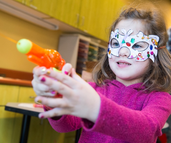 (Rick Egan  |  The Salt Lake Tribune)Lucy Bagley, 4, shoots colored paint out of a squirt gun at the Discovery Gateway, during their New Years Day celebration of cultural traditions from around the world including Romania, Iran, and Myanmar. In Myanmar they celebrate the new year with a water festival. Monday, January 1, 2018.
