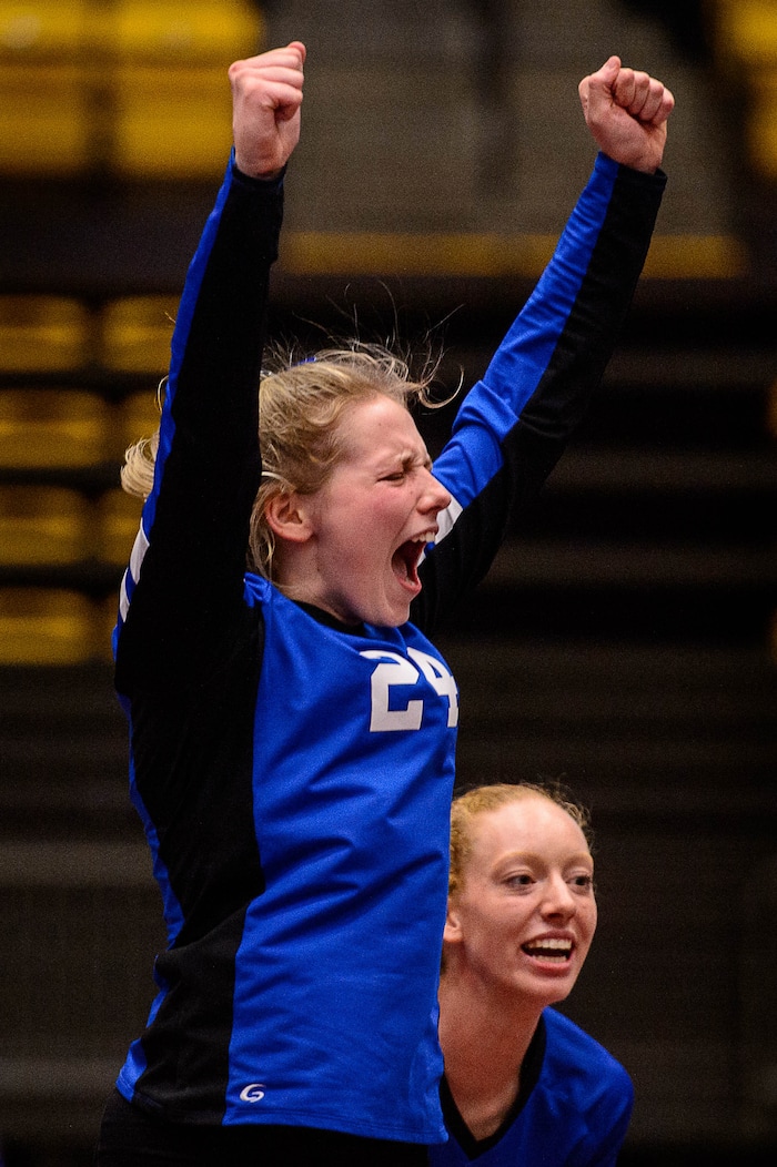 (Trent Nelson | The Salt Lake Tribune) Panguitch's Abbey Blevins and Panguitch's Taylia Norris celebrate a point as Panguitch defeats Rich in the 1A State Volleyball Championship game in Orem, Saturday October 28, 2017.
