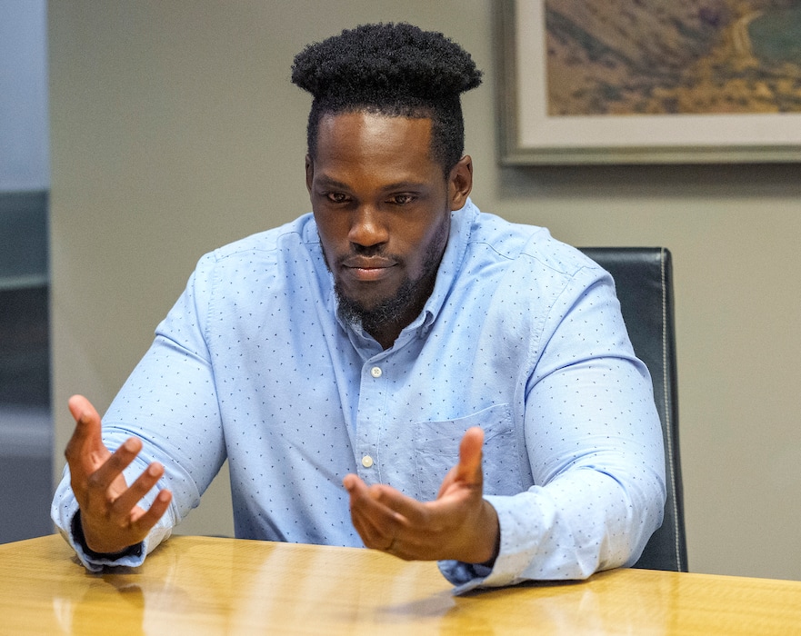 (Leah Hogsten | The Salt Lake Tribune) Gregory Noel, a Utah State University graduate, talks about his case in his attorney's office on Mar. 15, 2023. Noel filed a lawsuit alleging he was discriminated against during his time at Utah State. He signed a settlement agreement with the school in June 2023.
