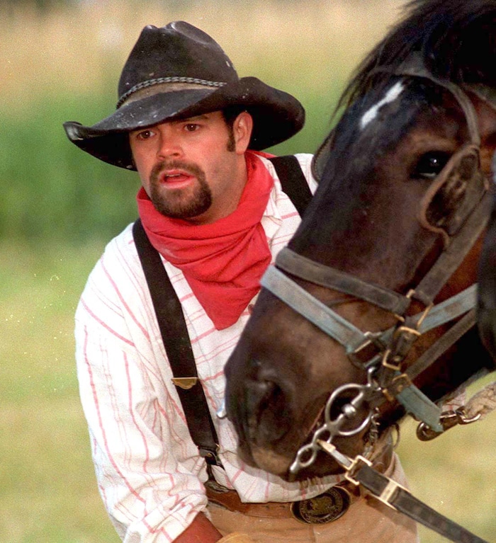 Rick Egan  | Tribune File Photo 

Larry Turbo Wayne Stewart, with his horse along the trail, in Henefer, Utah. 