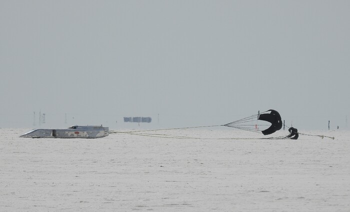 (Francisco Kjolseth  |  The Salt Lake Tribune)  Slowed down by parachute a car finishes a run during Speed Week at the Bonneville Salt Flats outside Wendover on Monday, Aug. 14, 2017.