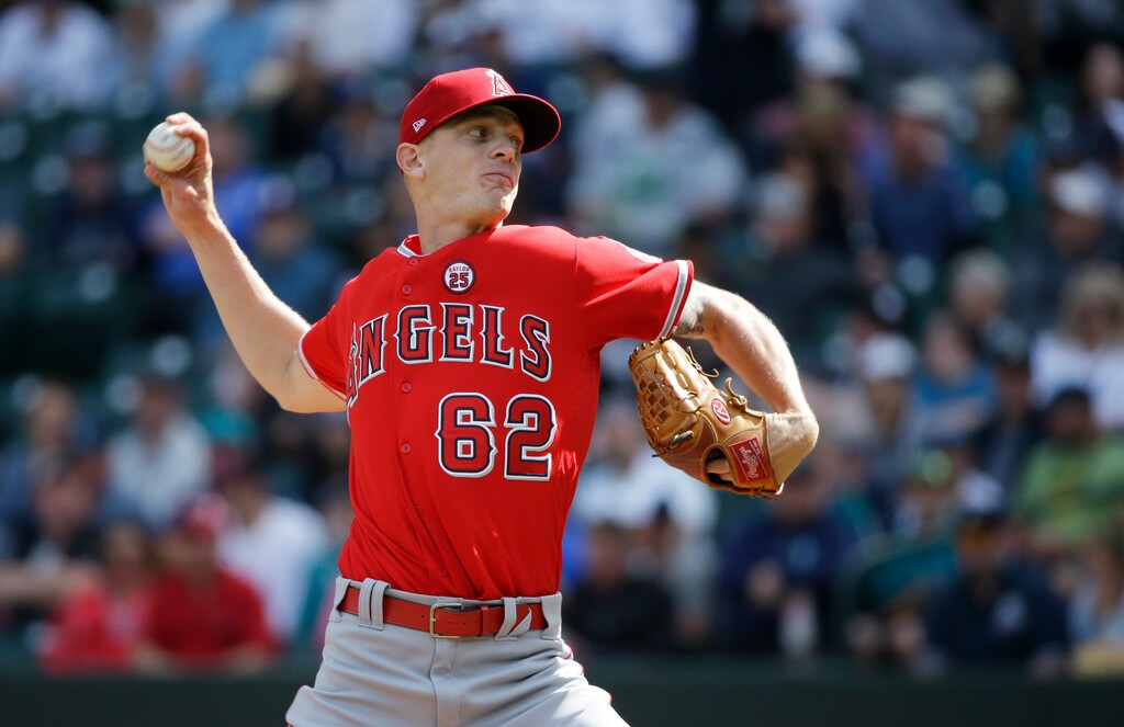 (Ted S. Warren | AP Photo) In this Sept. 10, 2017, file photo, Los Angeles Angels starting pitcher Parker Bridwell throws in the first inning of a baseball game against the Seattle Mariners in Seattle. Bridwell was claimed off waivers from the Angels by the New York Yankees on Monday, Nov. 26, 2018, who opened a roster spot by designating infielder Ronald Torreyes for assignment.