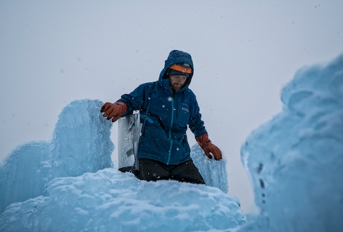 (A.J. Mellor |  courtesy of Ice Castles) An artisan works on the Ice Castles installation in Midway, Utah. The one-acre walk-through ice-and-light show is expected to open to the public in late December.