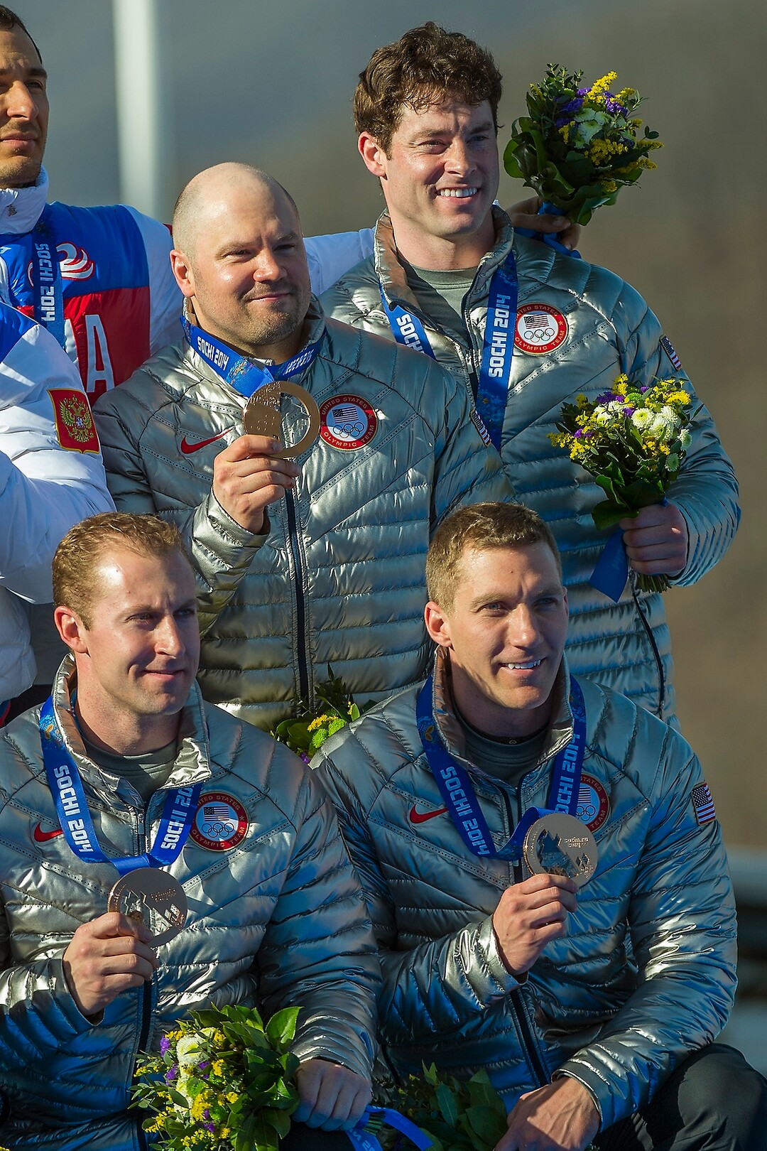 KRASNAYA POLYANA, RUSSIA  - JANUARY 23:USA's Steven Holcomb, Chris Fogt, Curtis Tomasevicz, and Steve Langton, celebrate during the medal ceremony at the finish of the four-man bobsled at Sanki Sliding Center during the 2014 Sochi Olympics Sunday February 23, 2014. They won the bronze medal with a cumulative time of 3:40.99. (Photo by Chris Detrick/The Salt Lake Tribune)